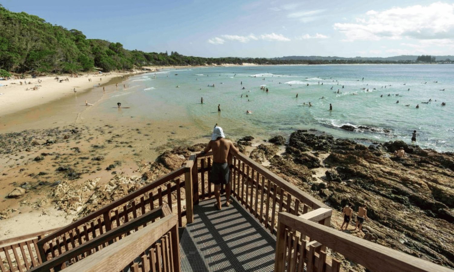 surfers in byron bay